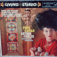 a dorky model holding a slew of faberge eggs on the cover of a classical music album